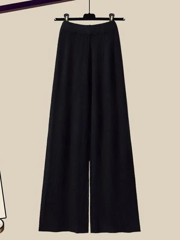Model in Marisa women's stylish 3-piece winter outfit: flowing knit cardigan, top, & coordinating pants.