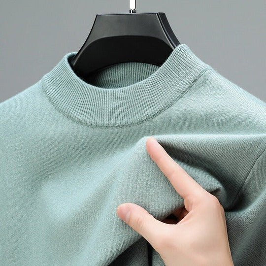 Modern men's mock neck sweater for layering, a fashionable pullover ideal for cool weather apparel.