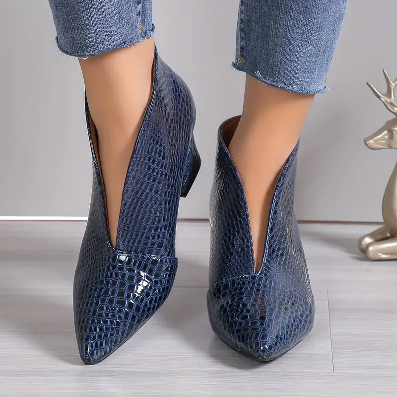 Stylish women's ankle boots with reptile texture, perfect for fall fashion and versatile wear.
