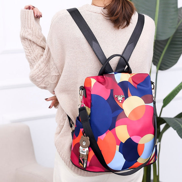 Stylish women's anti-theft water-resistant backpack for daily use & travel. Secure compartments & durable design.