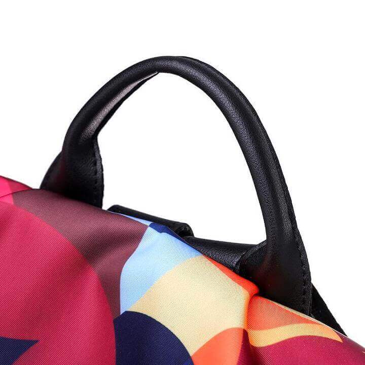 Side view of sleek water-resistant women's anti-theft backpack with convenient side pockets. Ideal for everyday.