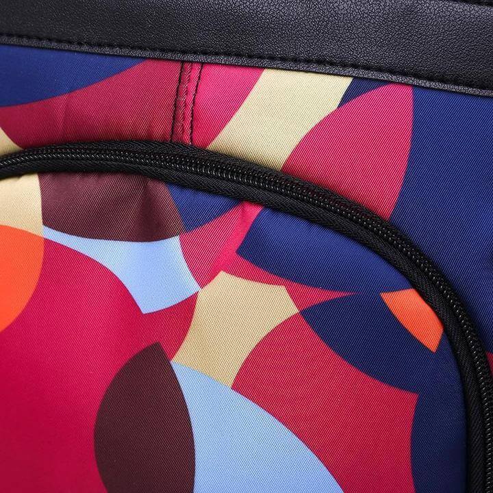 Woman wearing a chic water-resistant anti-theft backpack. Perfect for daily errands, work, or school.