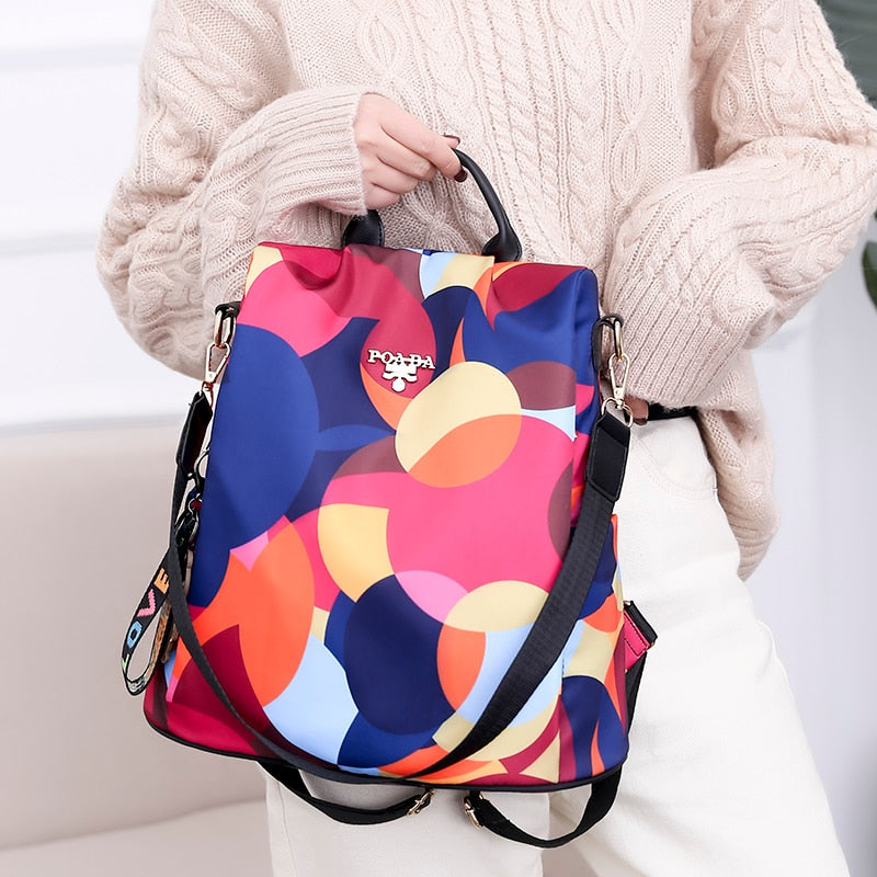 Front pocket of water-resistant anti-theft women's backpack. Quick access for essentials, ideal for travel.