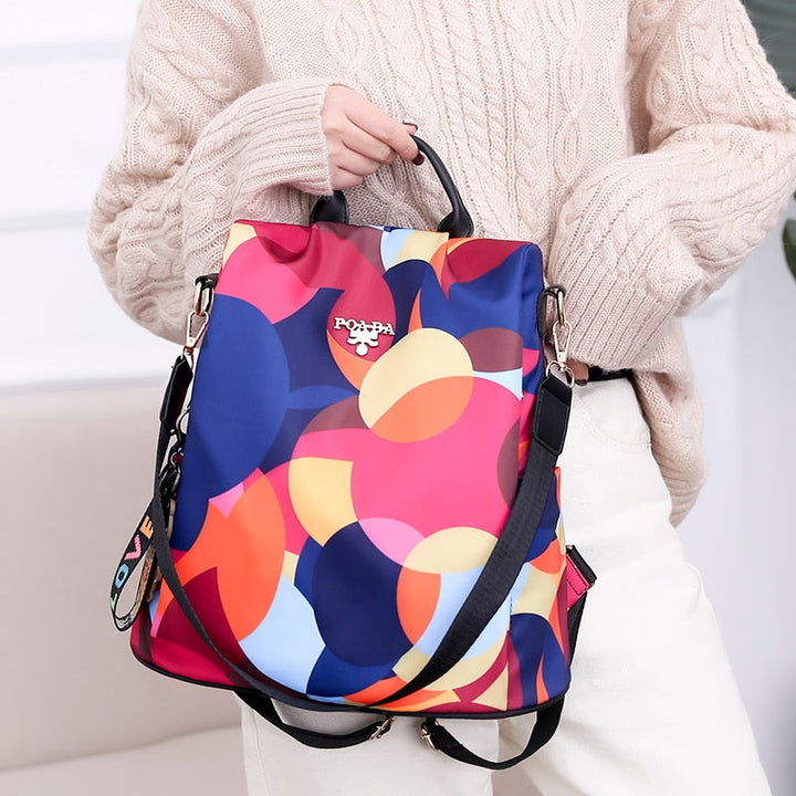Front pocket of water-resistant anti-theft women's backpack. Quick access for essentials, ideal for travel.