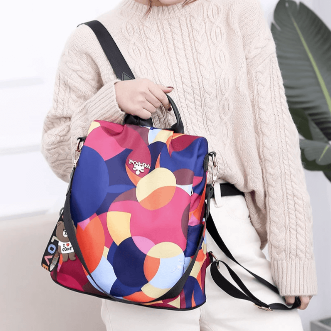 Dedicated laptop compartment in a women's anti-theft water-resistant school backpack. Protects your tech.