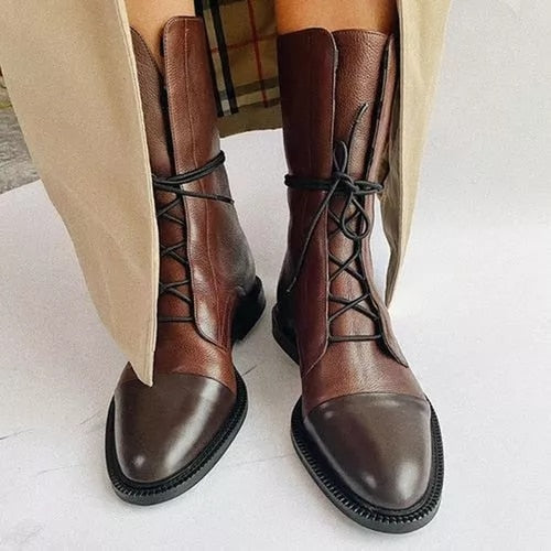 Model wearing women's lace-up leather ankle boots with jeans, demonstrating a stylish and practical winter look.