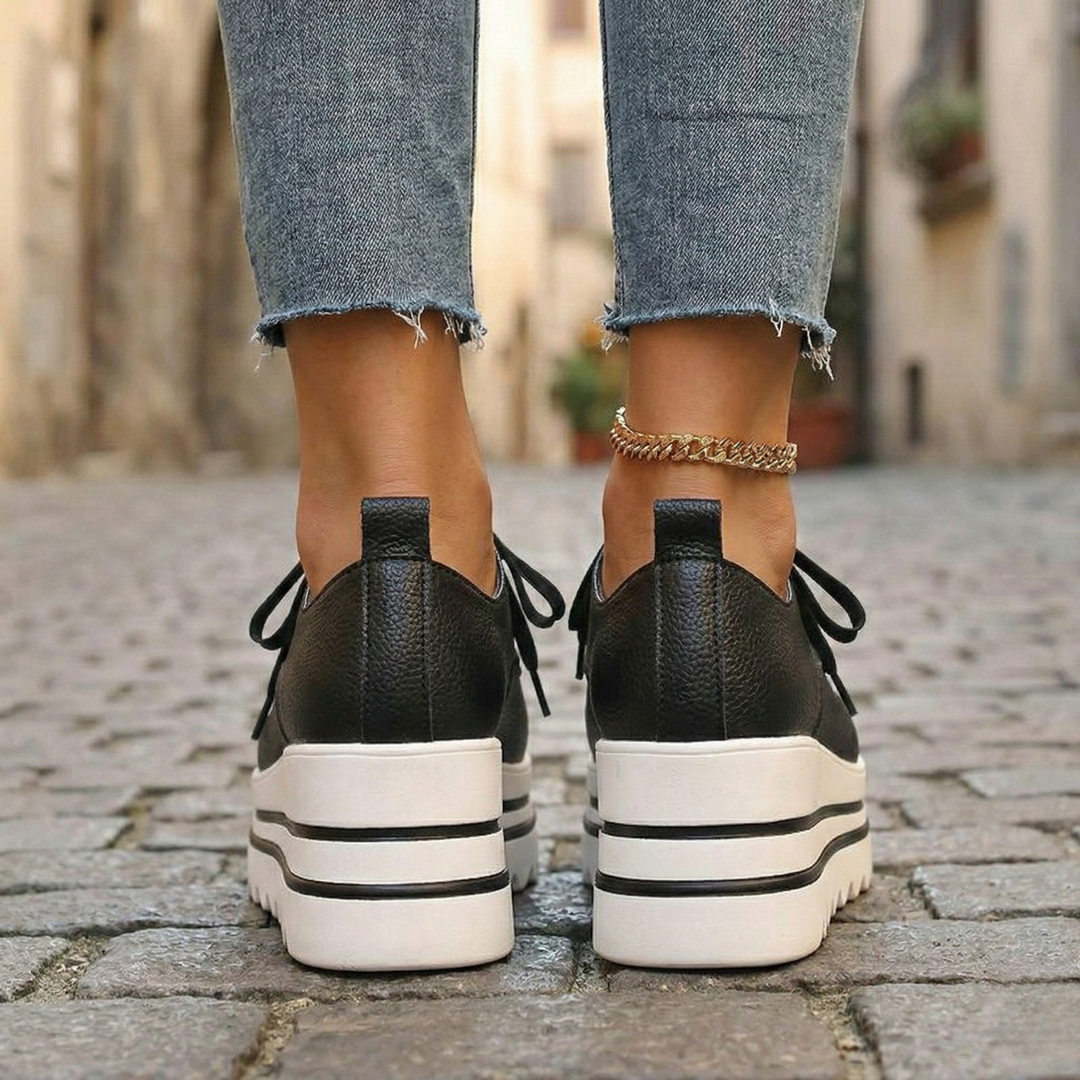 Close-up of women's trendy platform oxford shoes, featuring secure lace-up closure & chunky sole for fashion & comfort.