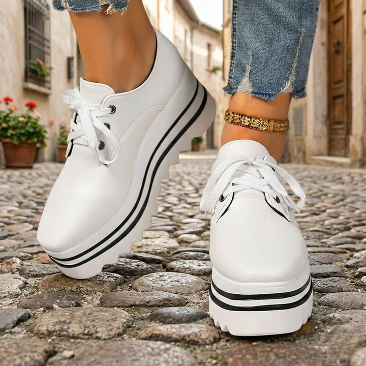 Comfortable women's lace-up platform oxfords, ideal for all-day wear, blending classic dress shoe style with modern comfort.