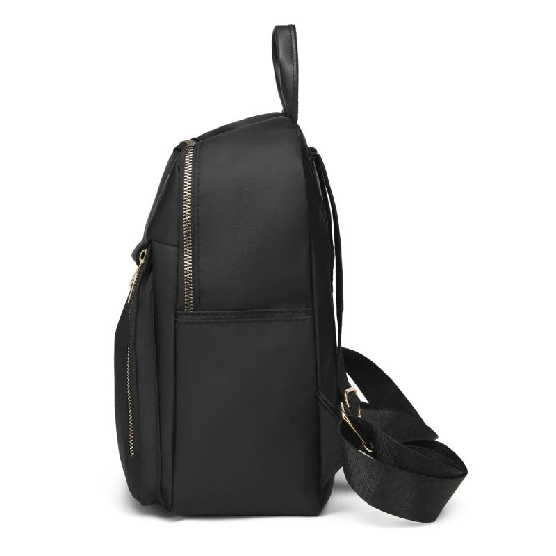 Durable PU leather women's backpack in black. A fashionable choice for travel, work, or daily errands.