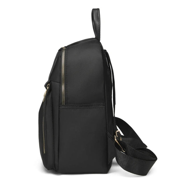 Durable PU leather women's backpack in black. A fashionable choice for travel, work, or daily errands.