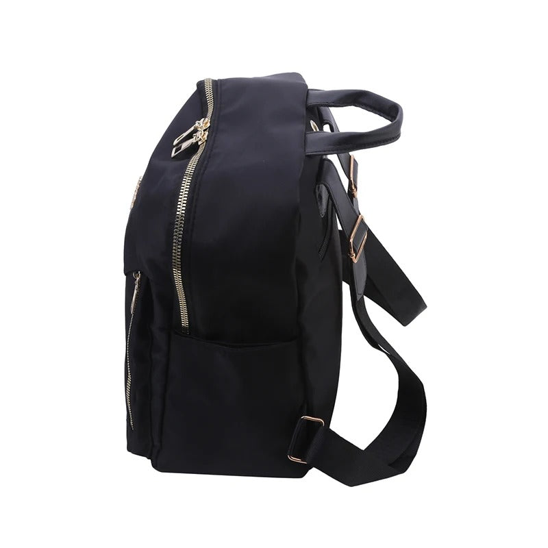 Women's black PU leather backpack, convertible for travel or daily use. Stylish & practical shoulder bag.