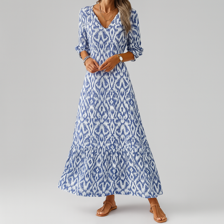 Stylish women's blue ikat print maxi dress. Flowing relaxed fit, V-neck, 3/4 sleeves. Perfect for summer.