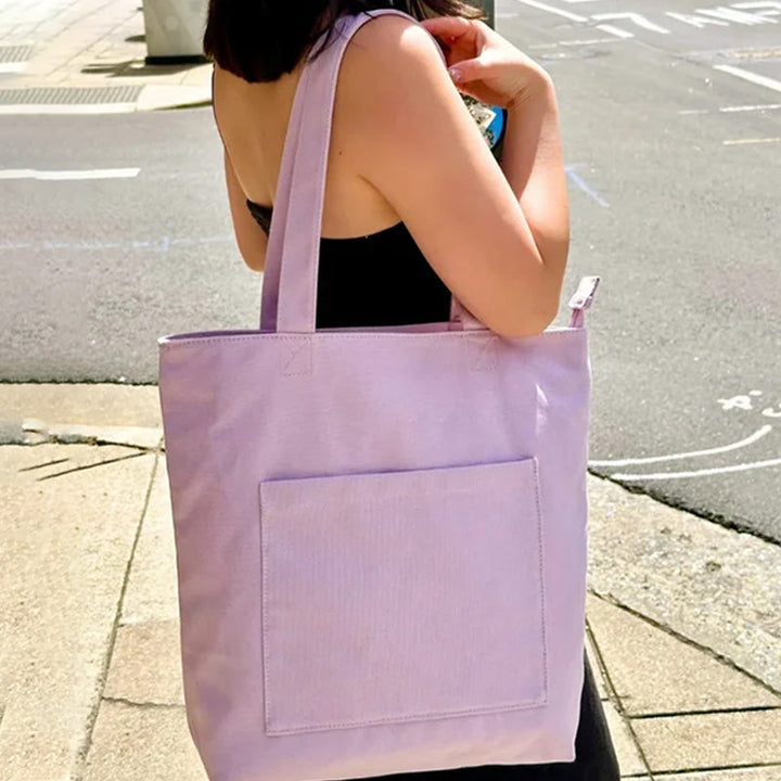 Corduroy tote bag in a vibrant color, offering a trendy and practical fashion accessory for women.