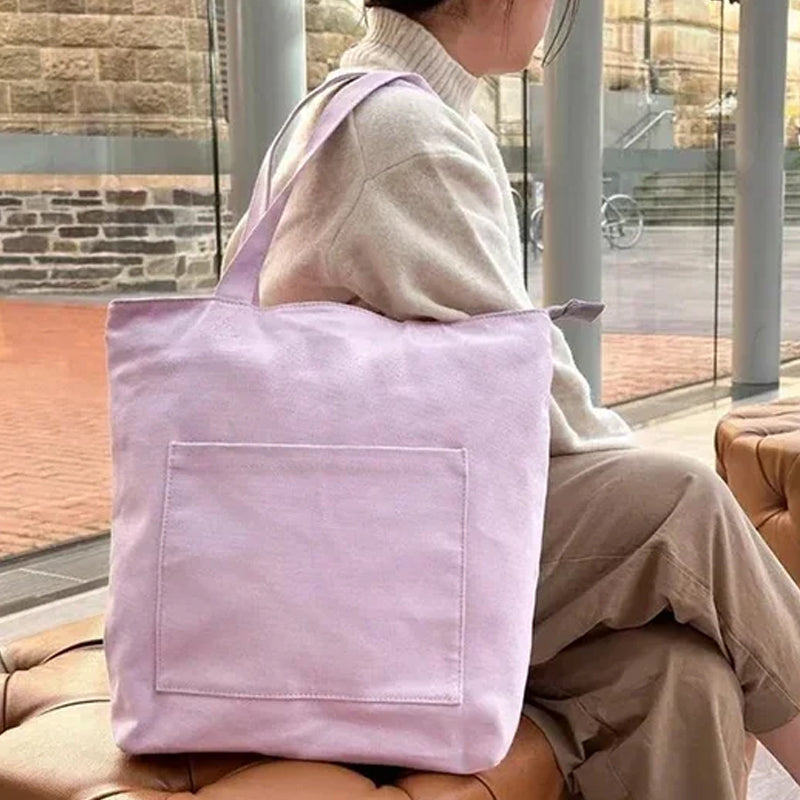 Close-up of a soft corduroy fabric casual tote bag, highlighting its textured material and spacious design.