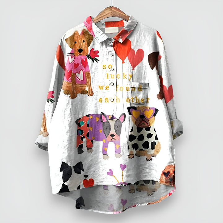 Women's long sleeve button-up blouse featuring an adorable dog print. Collared, relaxed fit, a stylish choice for casual wear.