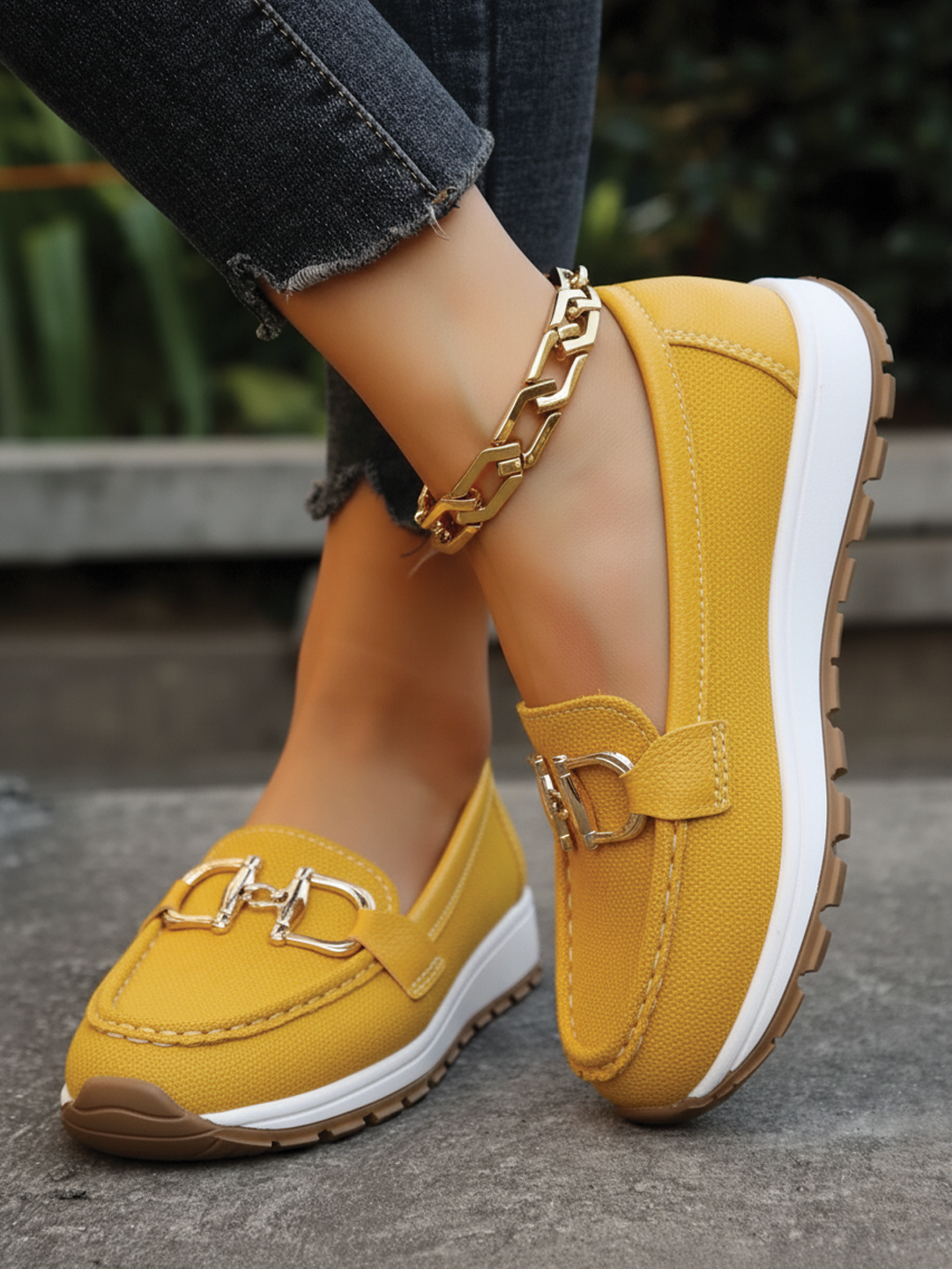 Modern women's flat buckle loafers; easy slip-on, comfortable everyday shoes for versatile styling.