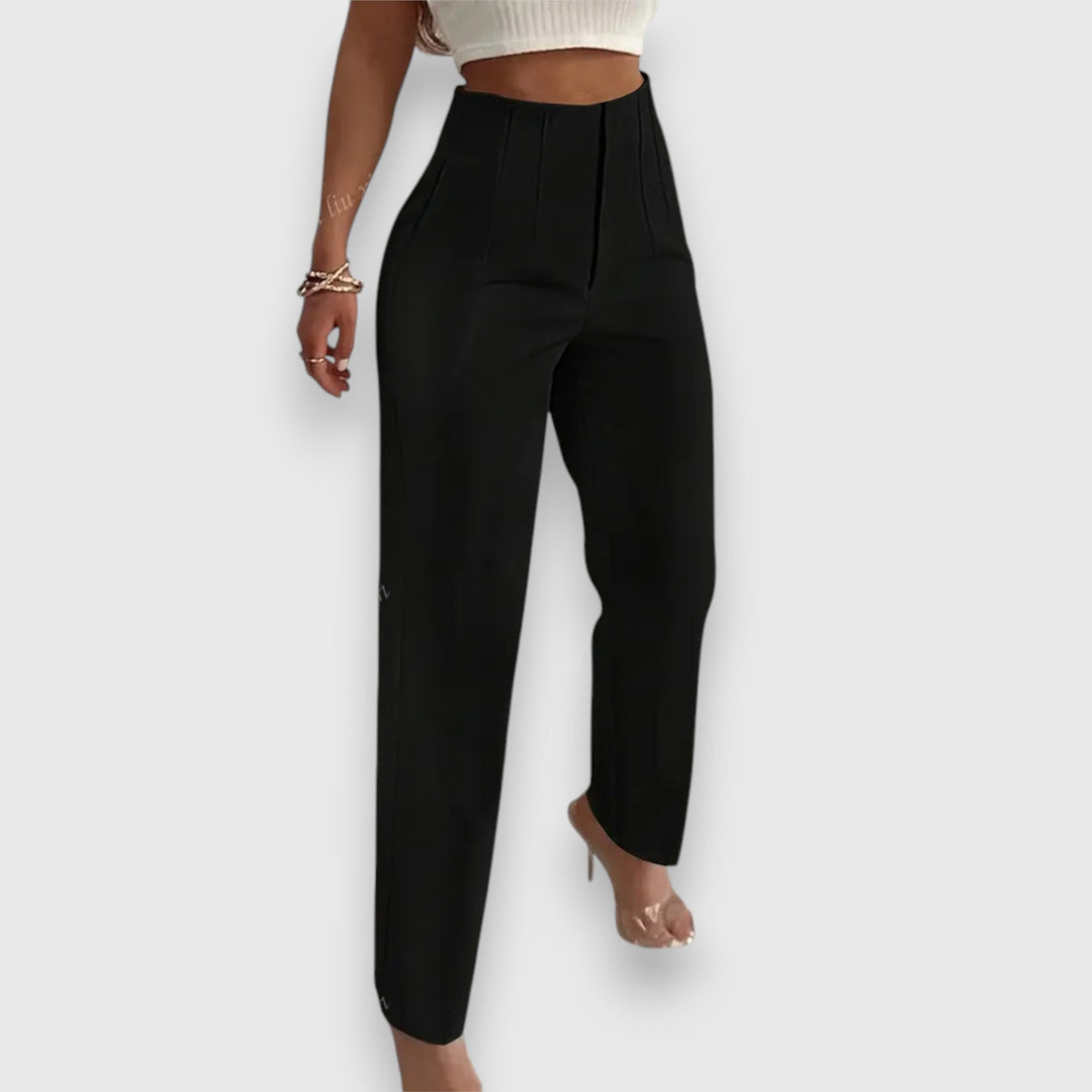 Model wearing modern women's high-waisted straight leg dress pants, styled for an elegant business casual outfit.