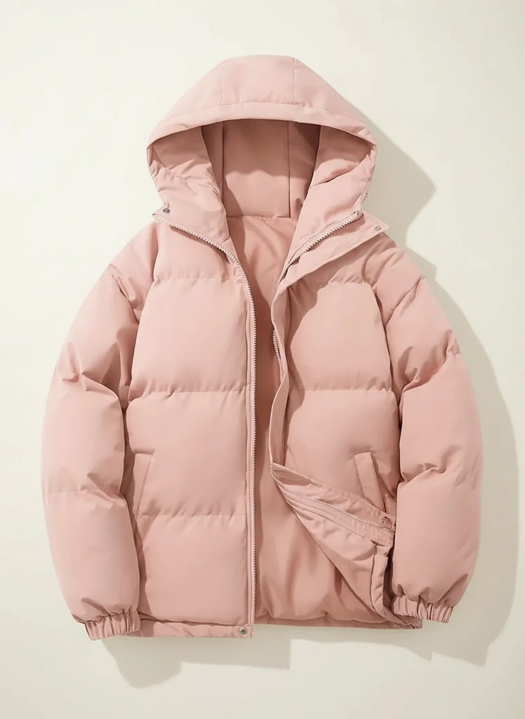 Fashionable women's winter puffer jacket, providing warmth and protection from cold weather elements.