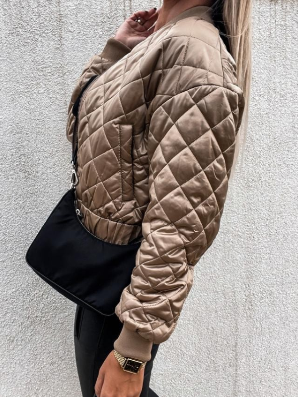Fashionable women's padded bomber jacket. Elevate your everyday style with this chic outerwear.