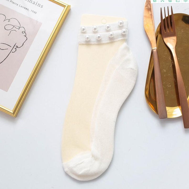 Unique fishnet ankle socks for women, featuring elegant pearl detailing.