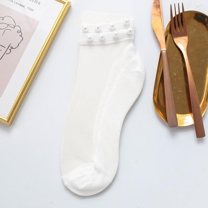Women's pearl fishnet ankle socks, offering a blend of classic elegance and modern style.