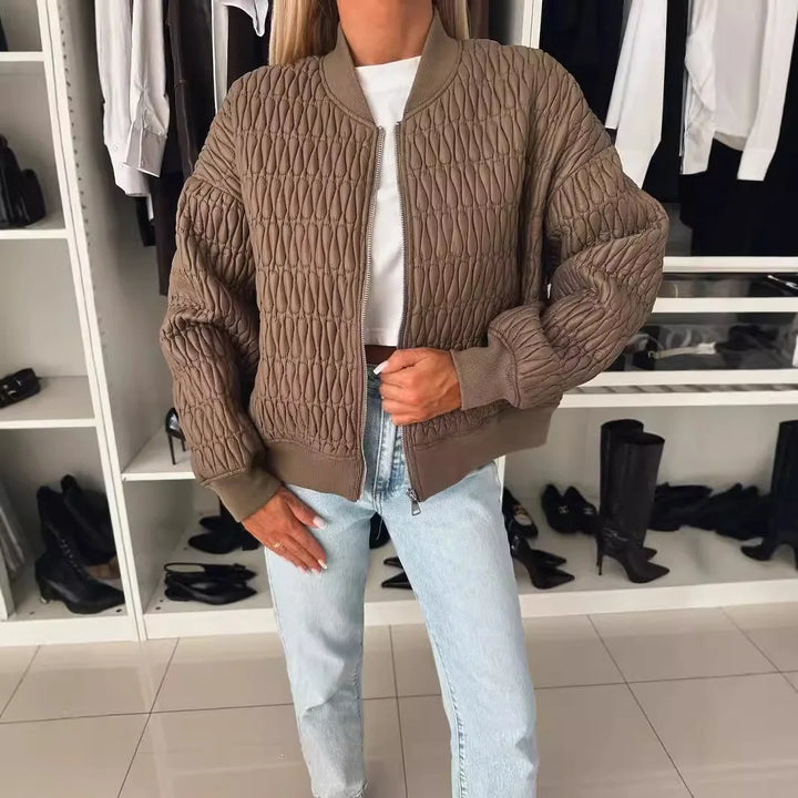 Full shot of a women's bomber jacket with unique quilted design