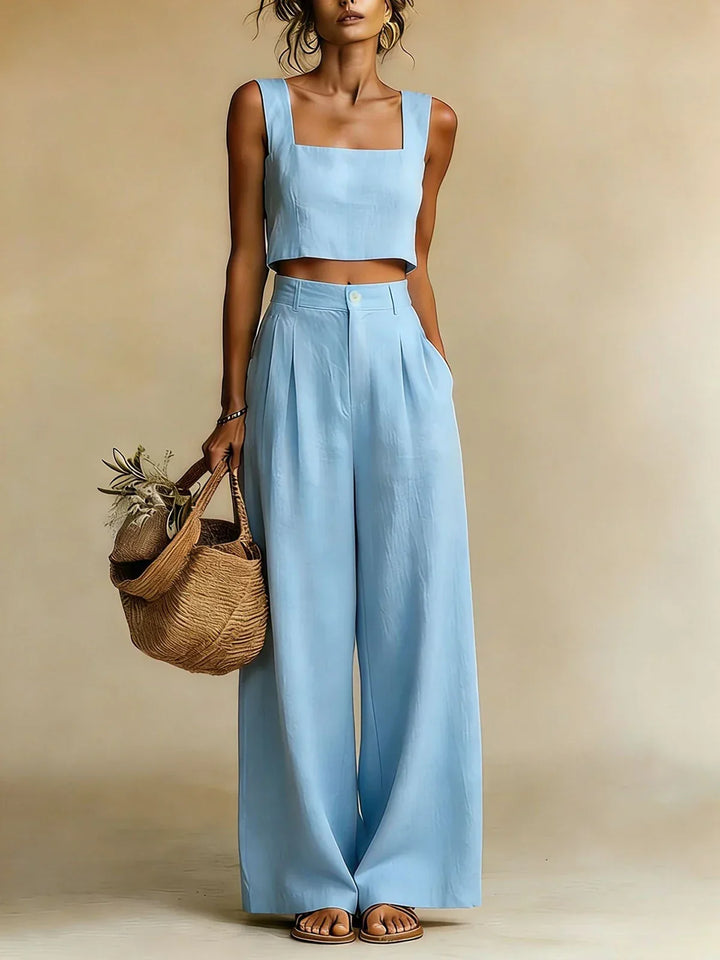 Fashionable women's two-piece palazzo outfit: relaxed top & wide-leg pants. Versatile for stylish summer wear.