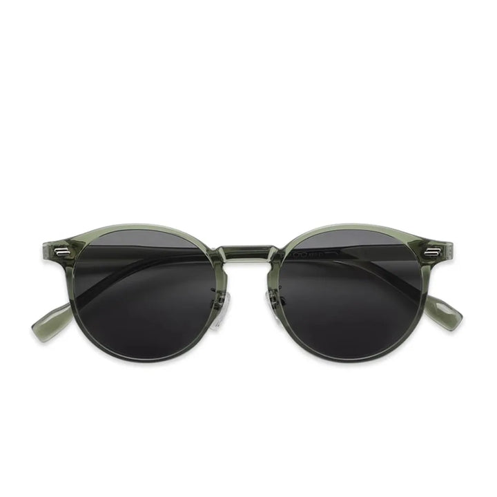 Fashionable round frame women's sunglasses in emerald green, offering UV400 protection and style.
