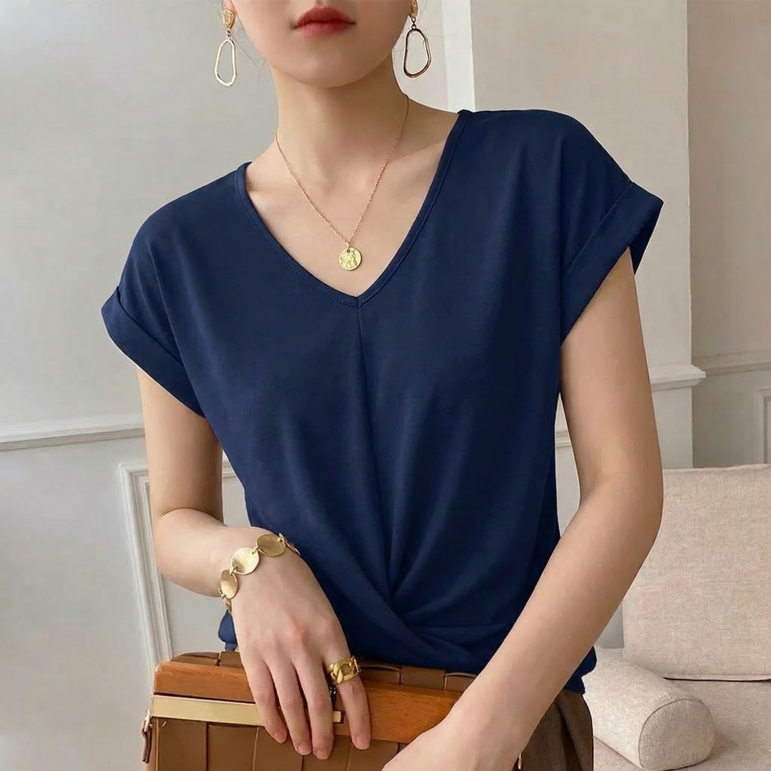 Comfortable women's short sleeve V-neck top featuring a stylish twist front. Ideal for spring and summer casual fashion.