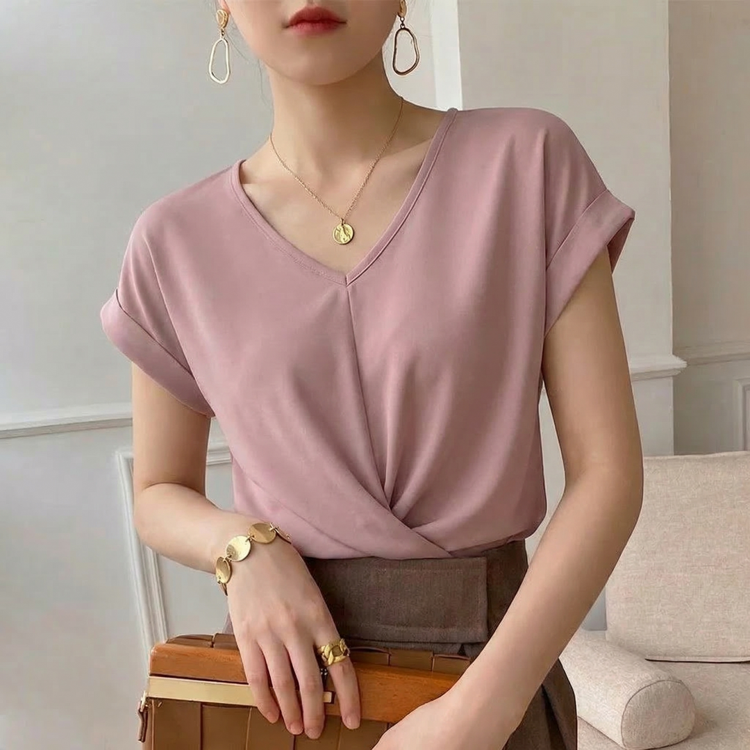Chic women's V-neck twist front blouse with short sleeves. A comfortable and stylish top for everyday fashion.