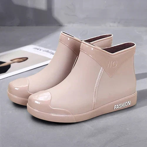 Durable women's waterproof ankle boots (Selis) with side zip, offering comfort and style for rainy days.