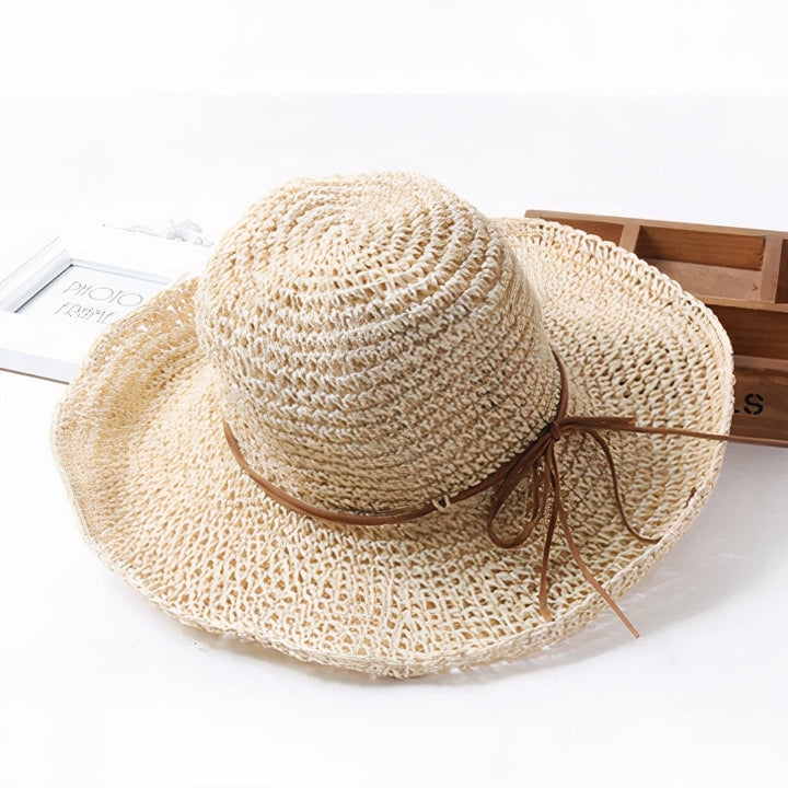 Elegant women's straw wide brim hat, perfect fashion accessory for summer vacation & sun protection.