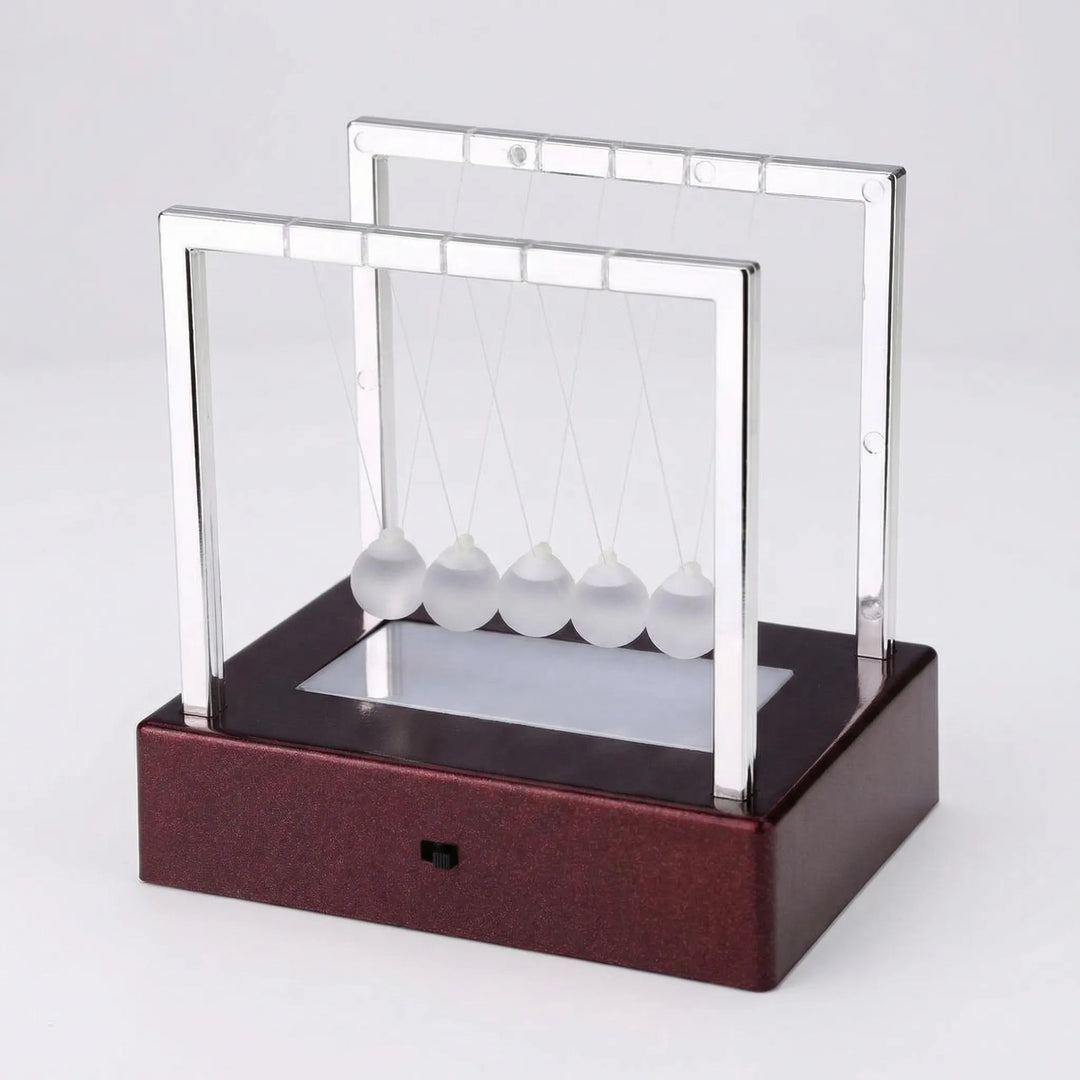 Elegant kinetic pendulum desk ornament with LED light display. Unique motion art for any tabletop.