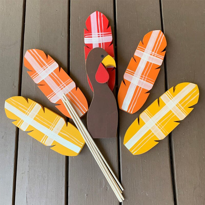 Rustic turkey garden stake with vibrant fall colors, ideal for seasonal outdoor display