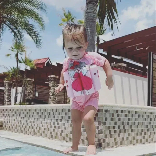 Toddler 3-in-1 float vest with long-sleeve rash guard & built-in shorts for sun protection.