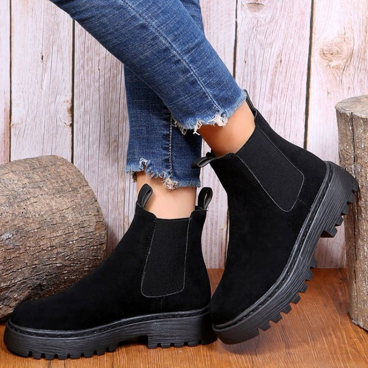 Women's platform Chelsea boots. Stylish ankle footwear with elastic panels and a chunky sole for modern street style fashion.