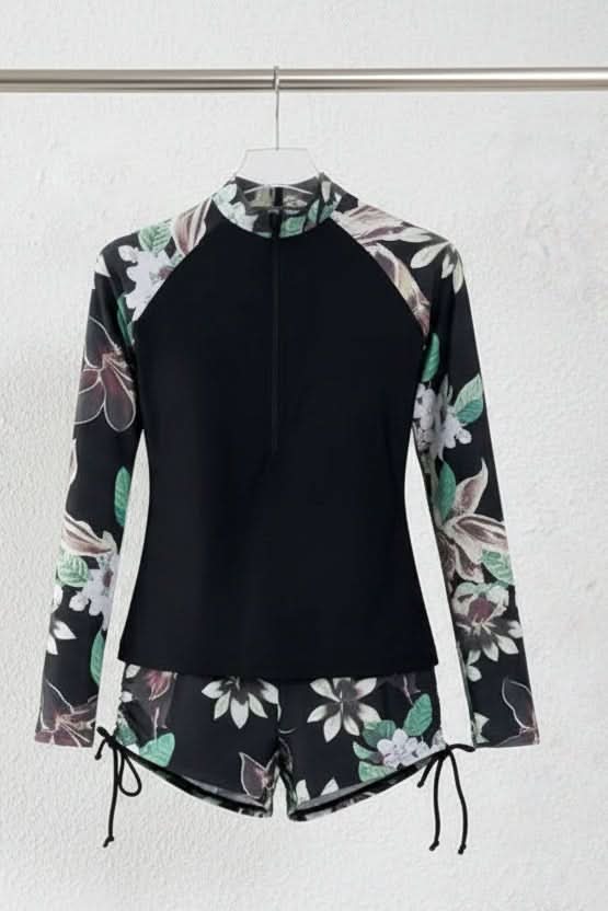 Vibrant tropical print women's two-piece swimsuit, featuring a rashguard top & high-waisted bottoms.