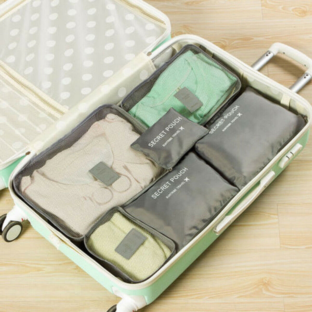 Unpacked 2-pack travel organizer set. Durable space saver bags for clothes, shoes, & trip accessories.