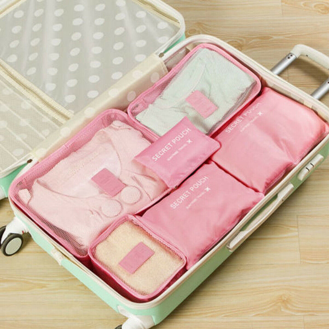 Neatly stacked packing cubes for travel gear. Essential space saver for orderly luggage organization.