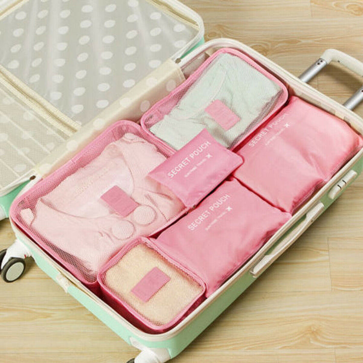 Neatly stacked packing cubes for travel gear. Essential space saver for orderly luggage organization.