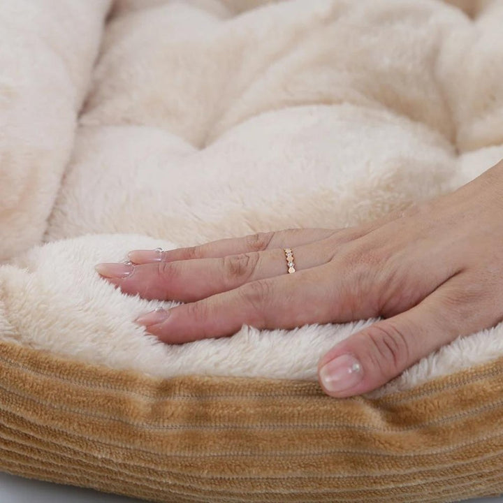 Luxurious plush dog bed provides ultimate comfort & calming support for anxiety. Perfect pet rest area.