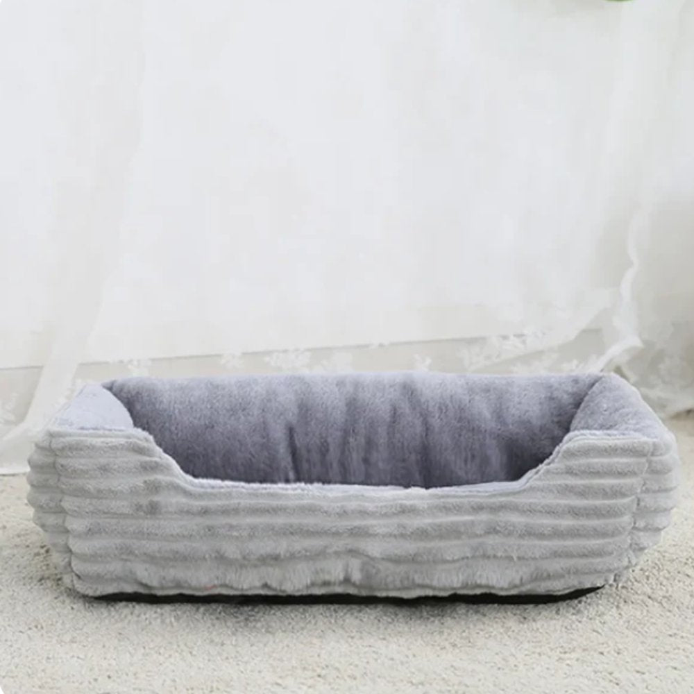 Small calming dog bed, ultra soft plush for ultimate comfort. Washable pet bed, cozy rest for your furry friend.