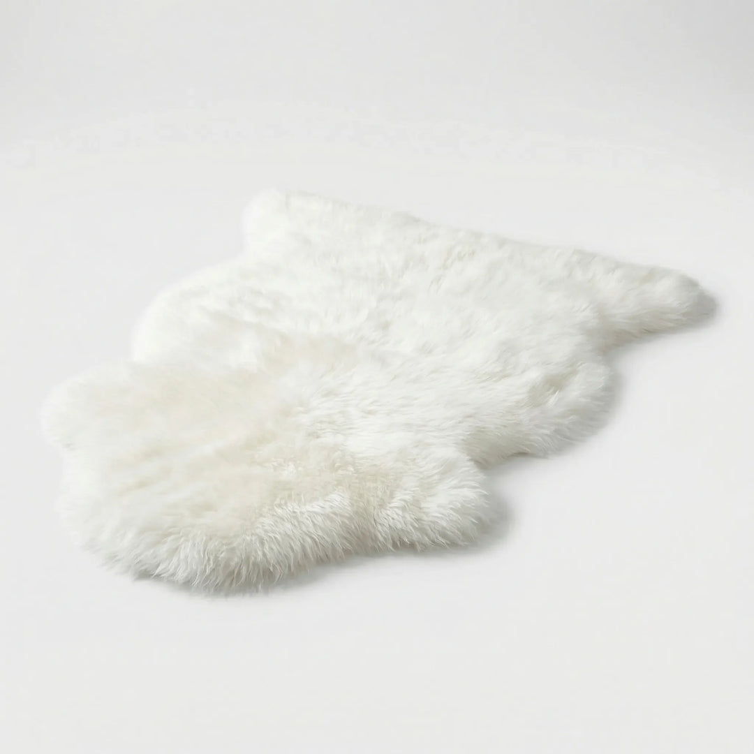Flowique statement area rug with elegant wave patterns, a soft faux fur design for living room or bedroom.