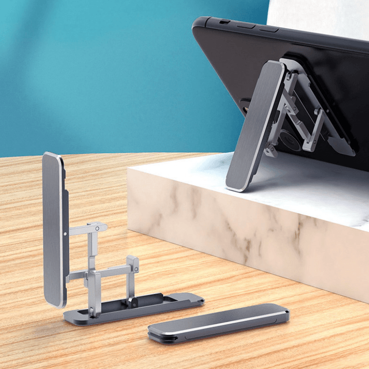 Compact and portable phone stand, ultra-thin design, universally compatible for smartphones, black finish.