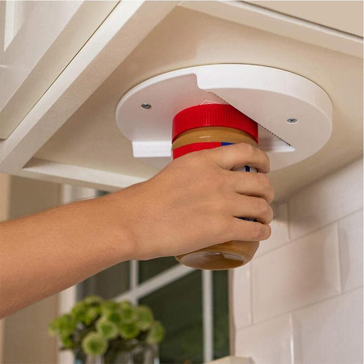 Compact kitchen gadget: under cabinet jar opener, no-slip grip, designed for effortless opening of lids.