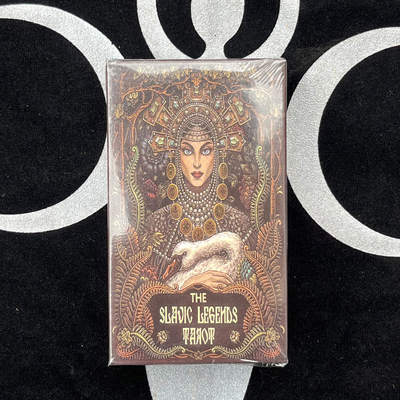 A pair of hands examining the unique illustrated tarot cards, highlighting connection and introspection