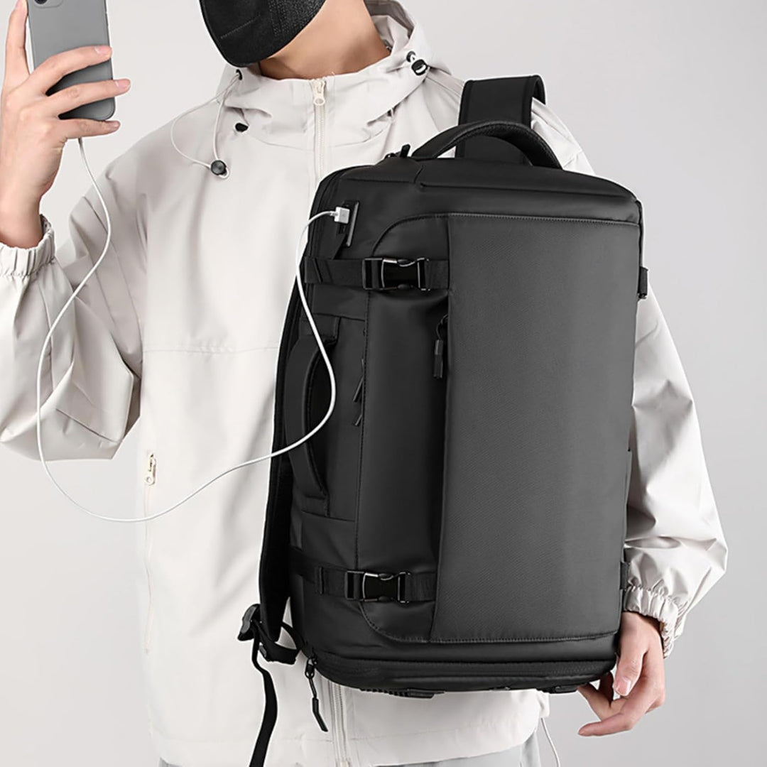 Black 15-inch waterproof tech backpack with integrated USB-C port, protecting laptops for modern commuters.