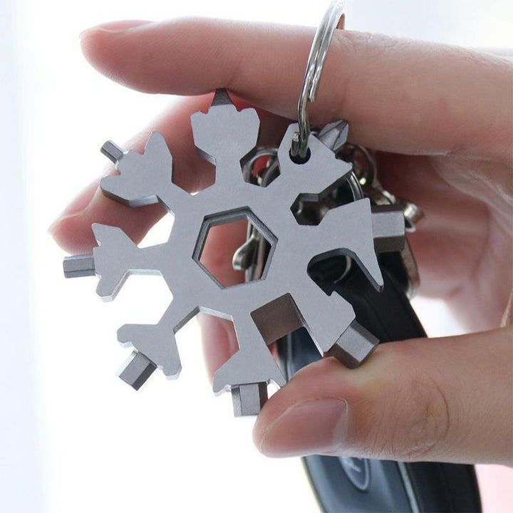 Shiny silver snowflake multi-tool keychain, ideal gift for mechanics, handymen, and adventurers