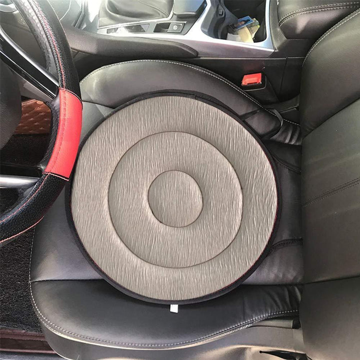 Top-down view of a round 360° rotating seat cushion, showing its full swivel capability, comfort aid