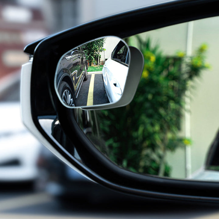 Adjustable blind spot mirror for seamless rear view coverage